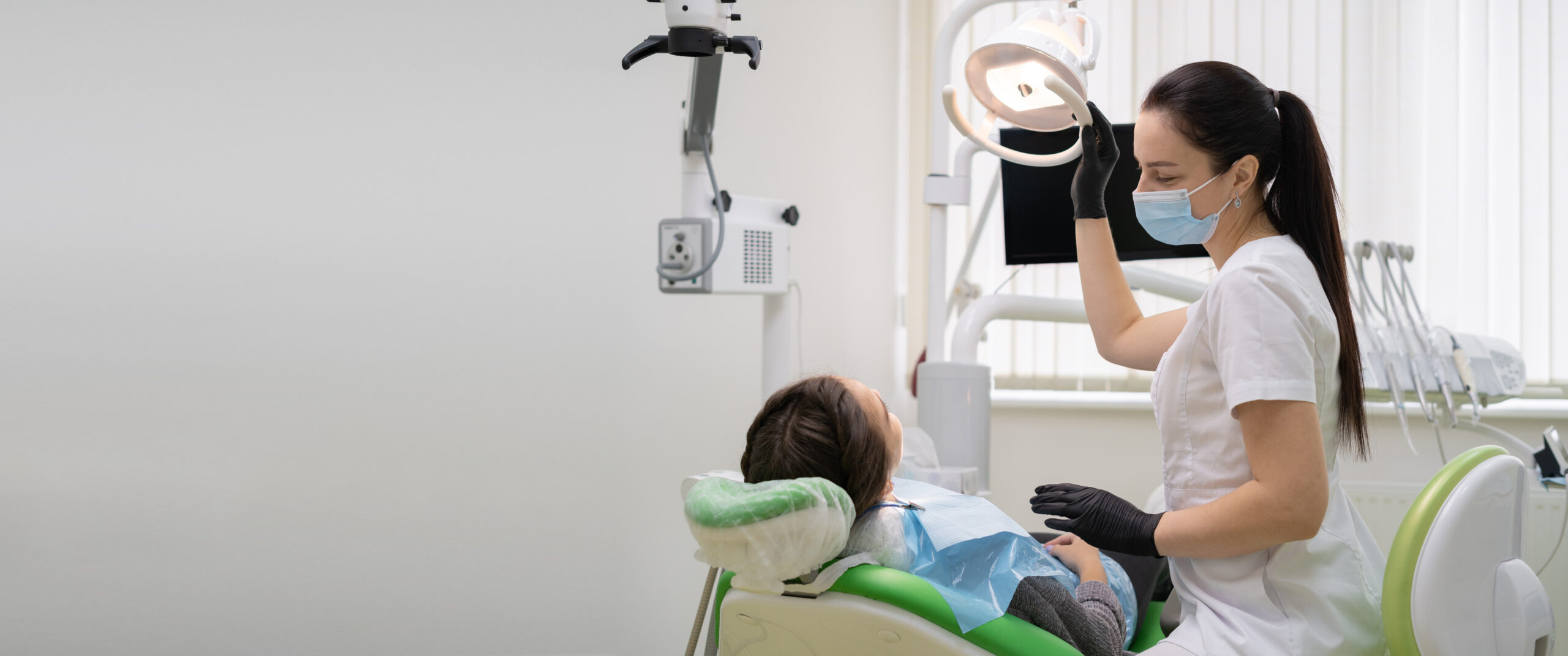 Dentist reviewing dental implant healing timeline with patient